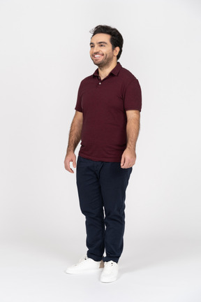 A smiling young man wearing casual clothes