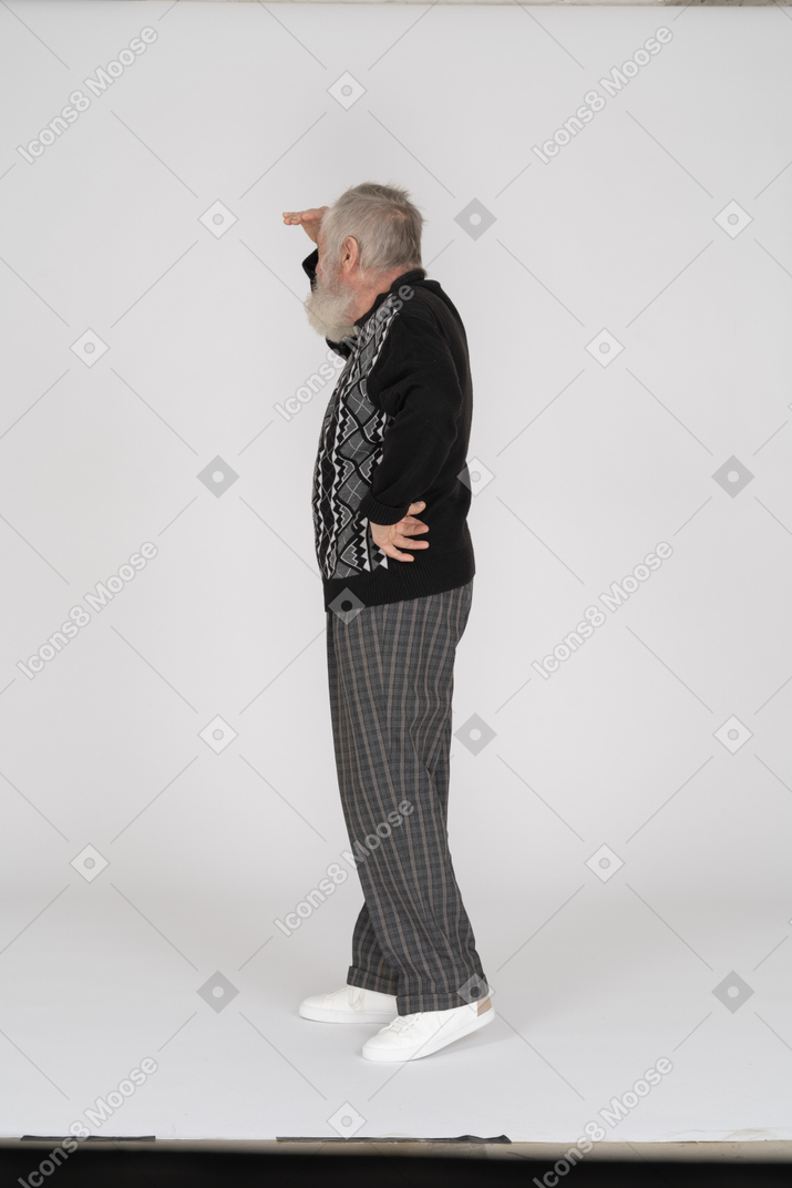 Side view of old man looking into distance