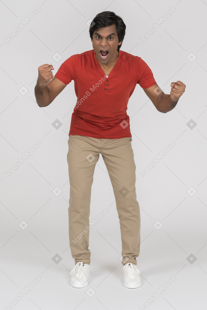 Excited young man celebrating something