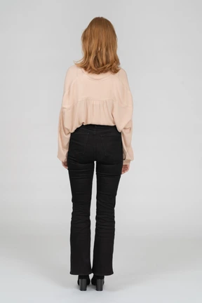 Back view of young woman standing