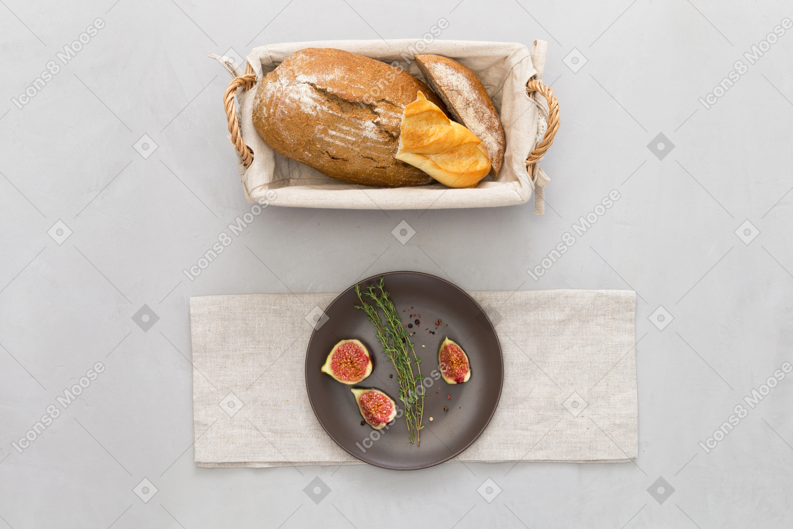 A loaf of bread and some figs on a plate