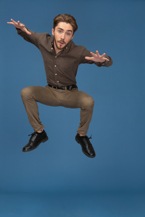 A jumping slim young man