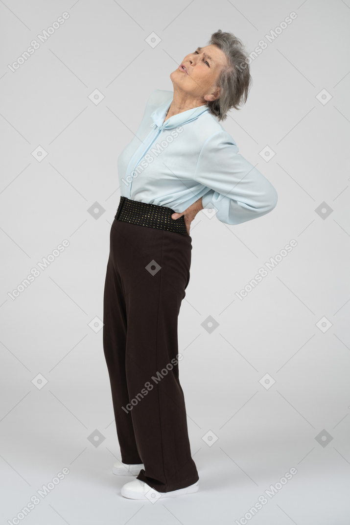 Old woman suffering from back pain