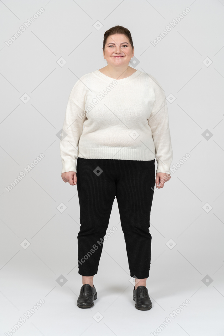 Happy woman in casual clothes looking in camera