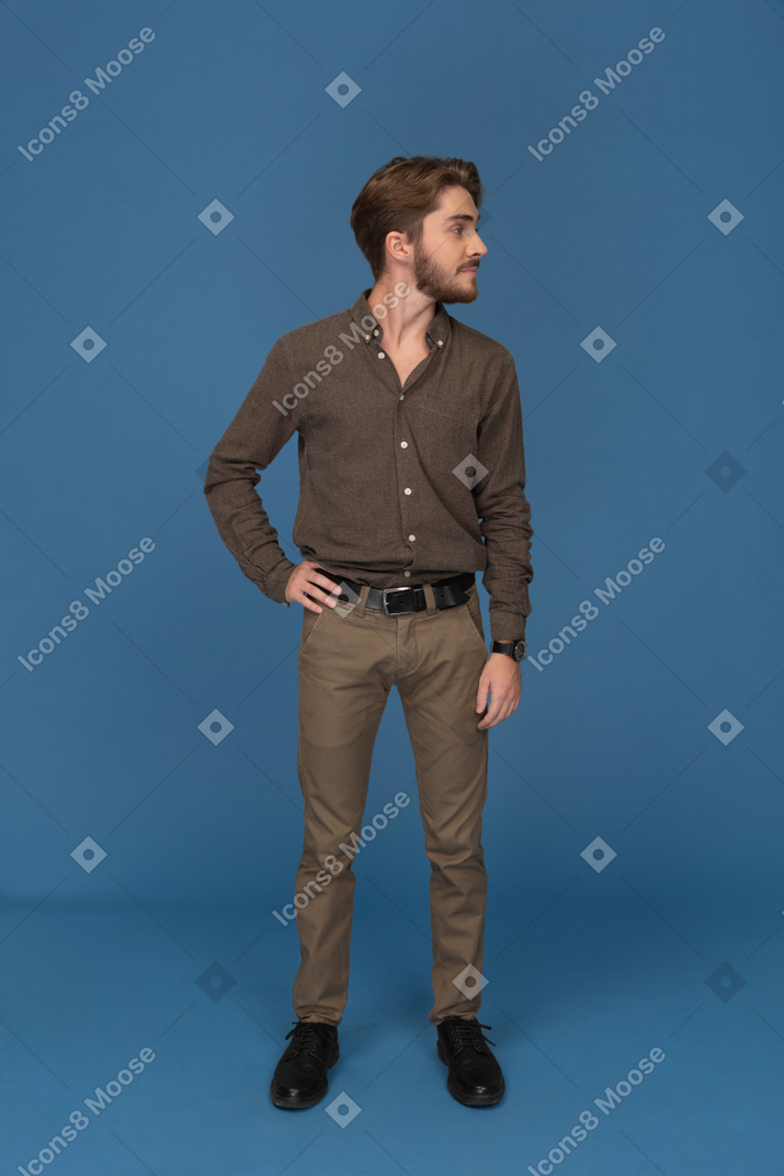 A slim young man standing