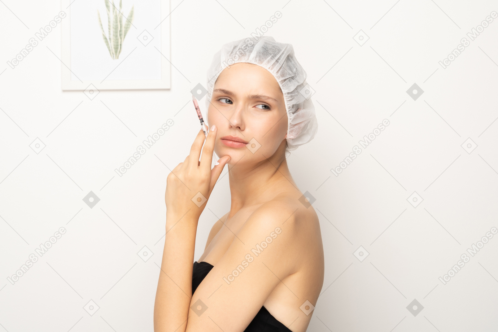 Woman standing with syringe