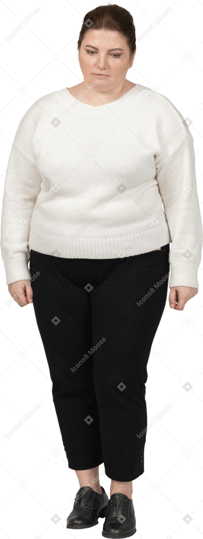 Sad woman in white sweater looking down