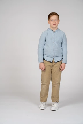 Happy boy looks at camera