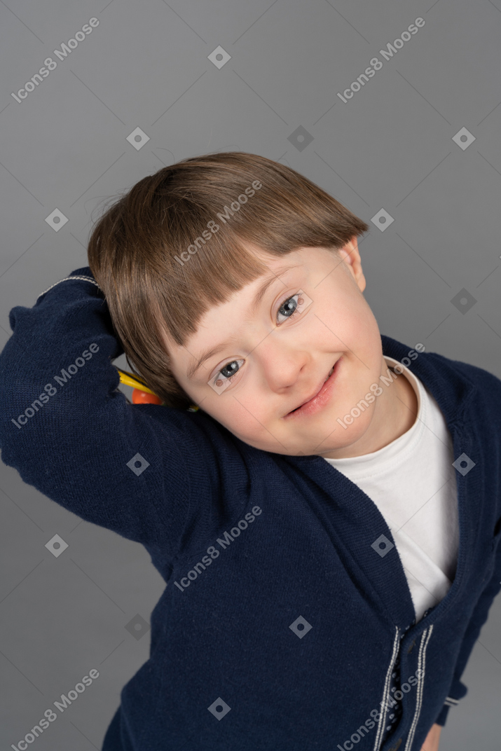 Cheerful little boy smiling for a camera