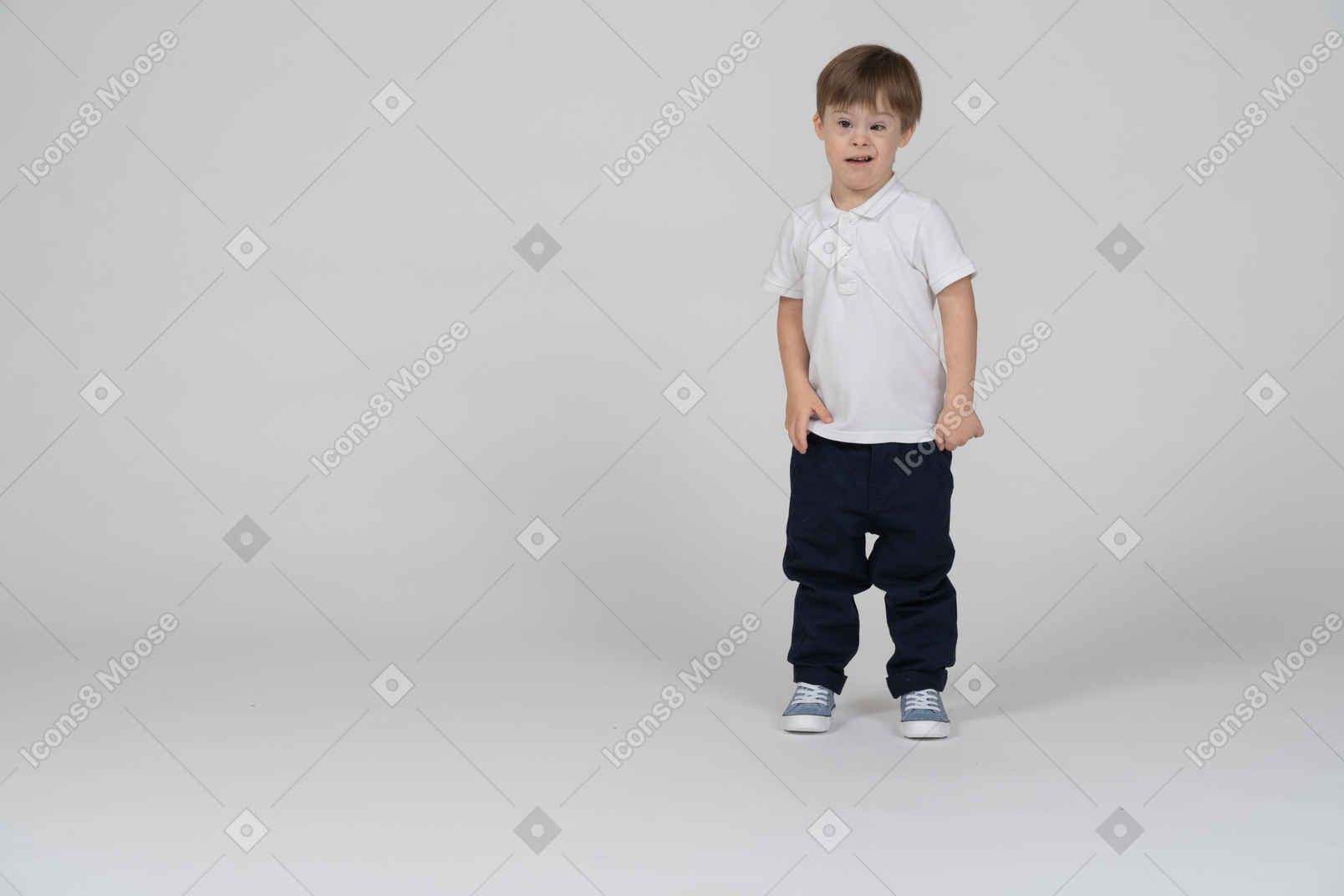Front view of a boy standing and looking puzzled