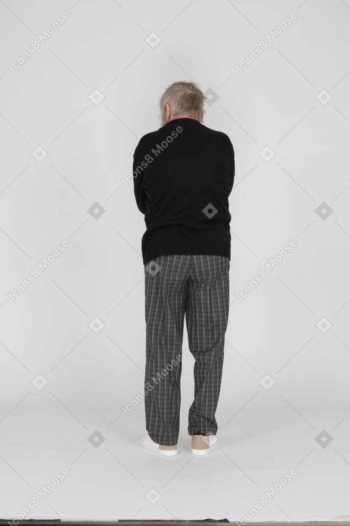 Rear view of a standing old man