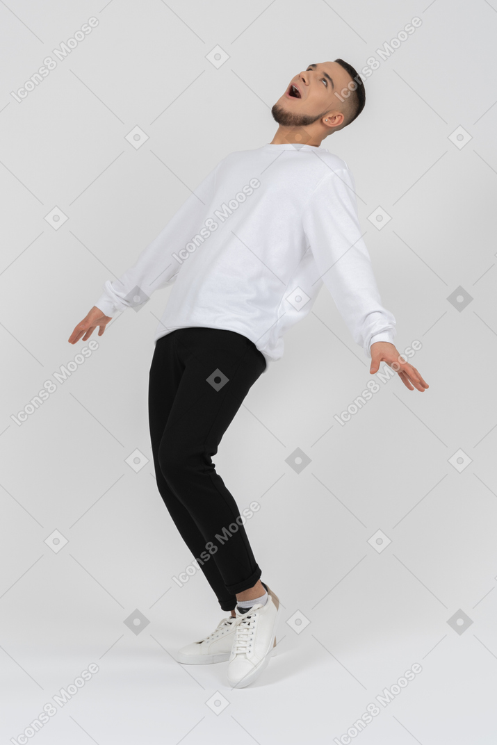 Young man in casual clothes fainting