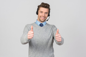 Call center agent showing thumbs up with both hands
