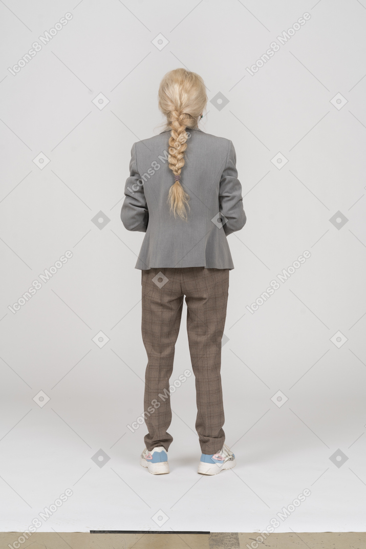 Back view of an old lady in suit