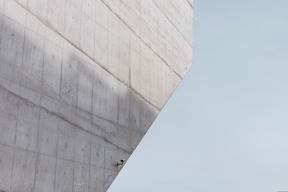 Blue sky and a concrete wall