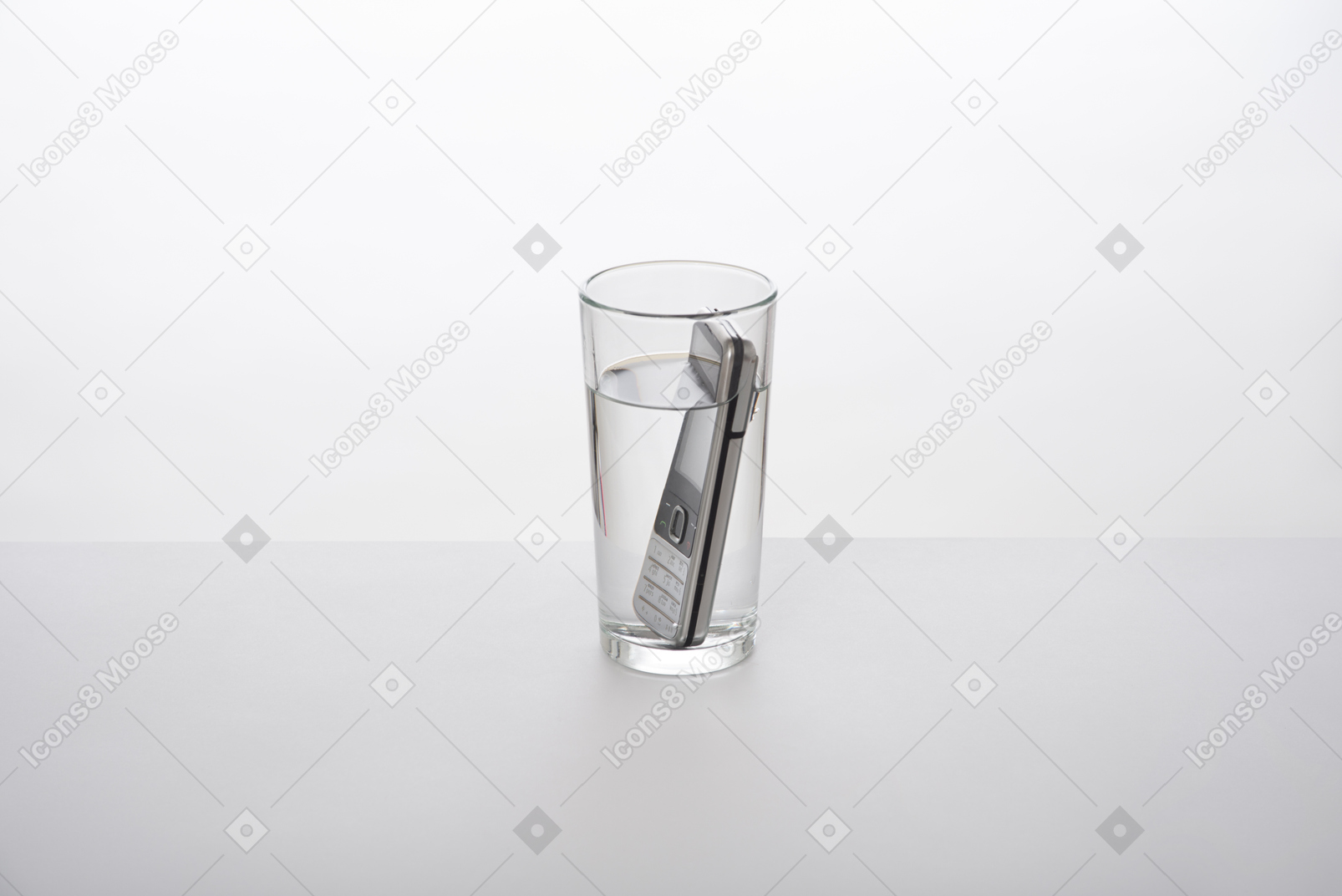 Cell phone in a glass of water
