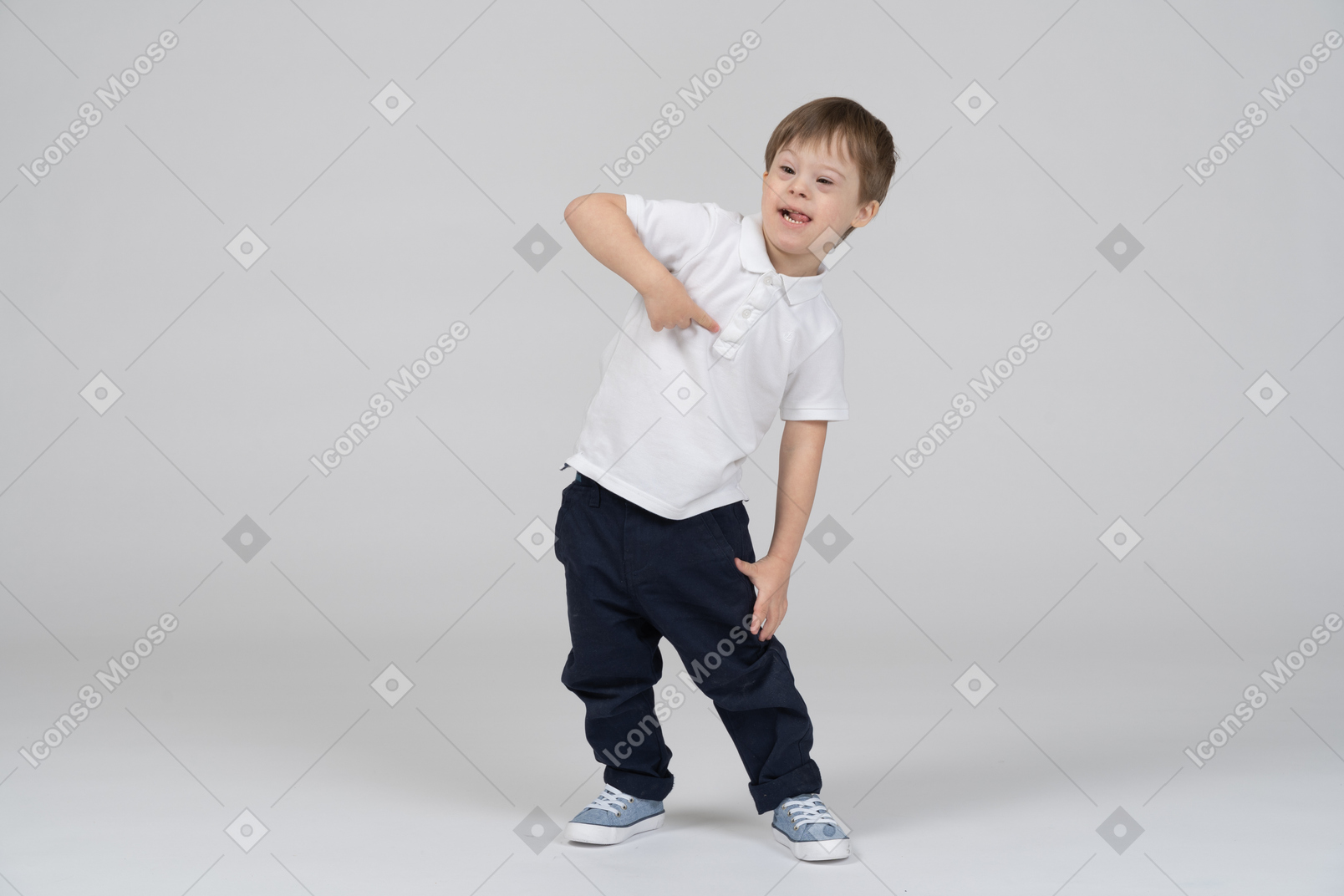 Front view of a cheerful boy pointing at himself