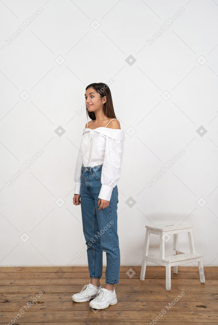 Excited smiling woman standing in room