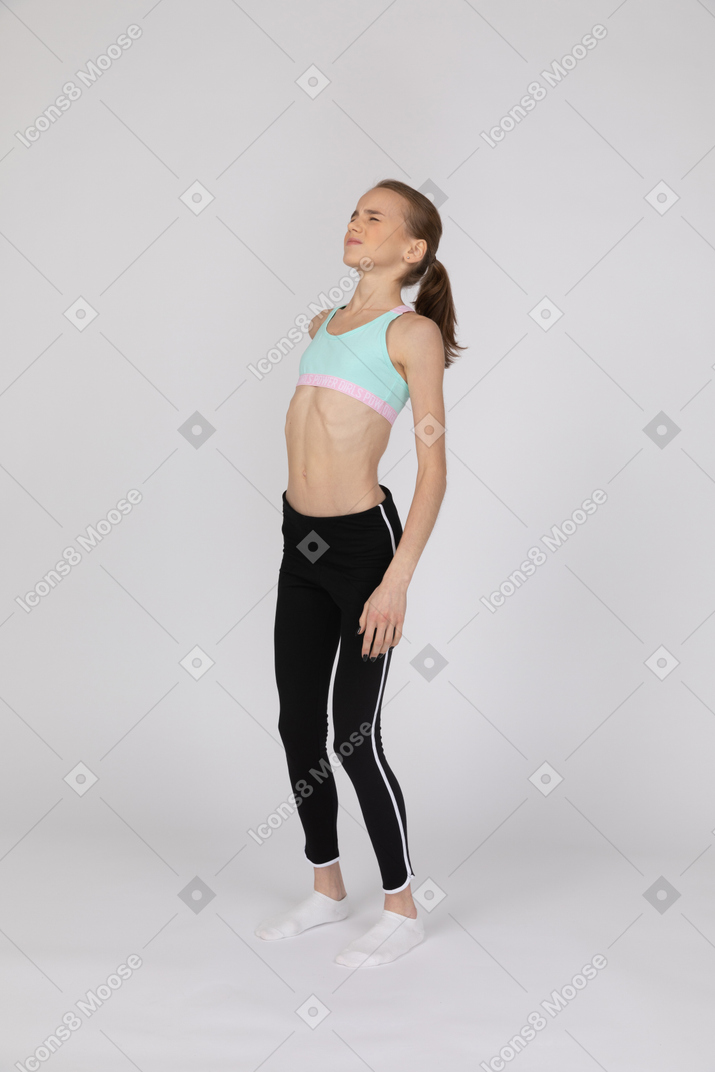 Teen girl in sportswear suffering from pain
