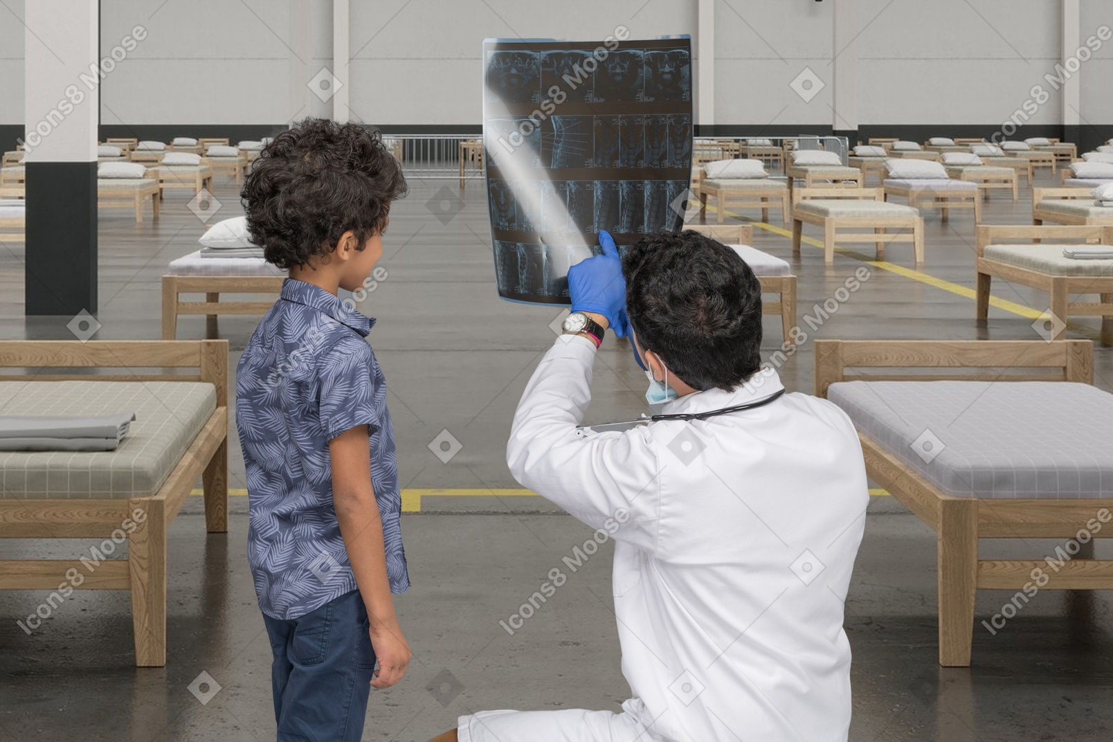 Arzt und kleiner junge betrachten ein röntgenbild
