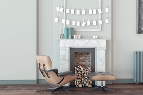 Room with mantlepiece, armchair and footstool