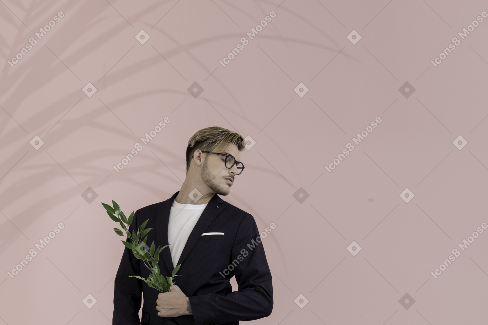 Portrait of a young man holding a laurel branch