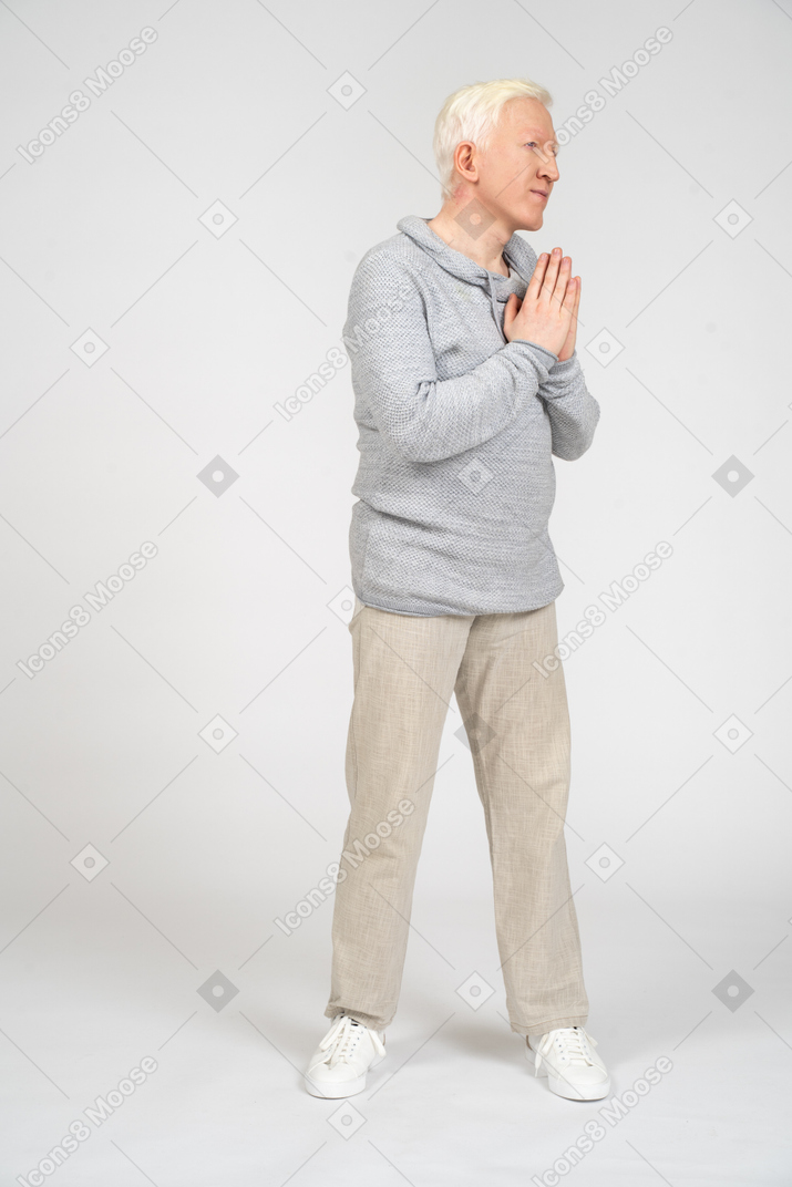 Three-quarter view of a man praying
