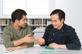 A couple of men sitting at a table