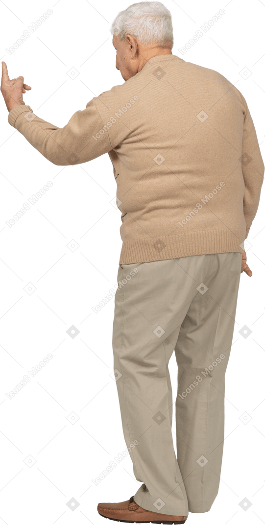 Rear view of an old man in casual clothes showing v sign