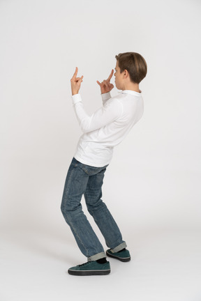 Young man in casual clothes standing