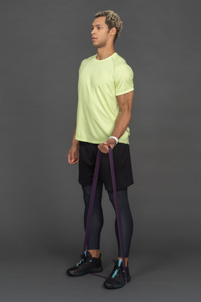 Man exercising with a resistance band
