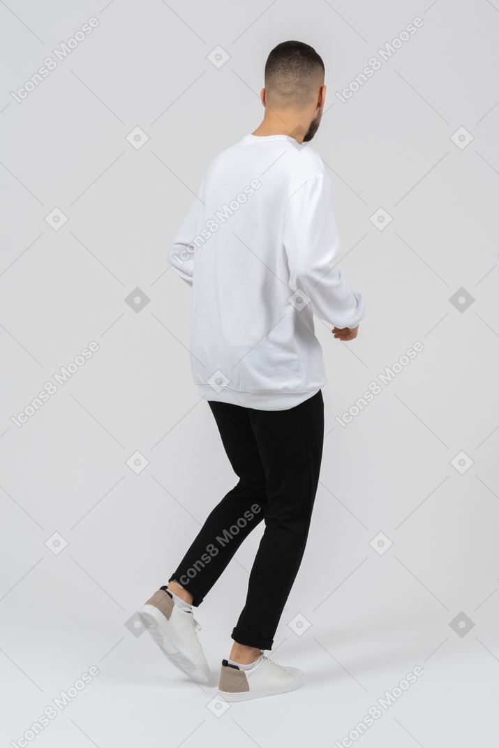 Young fashionable man walking