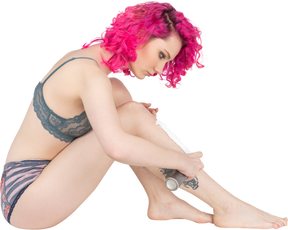 Pink haired girl applying shaving foam