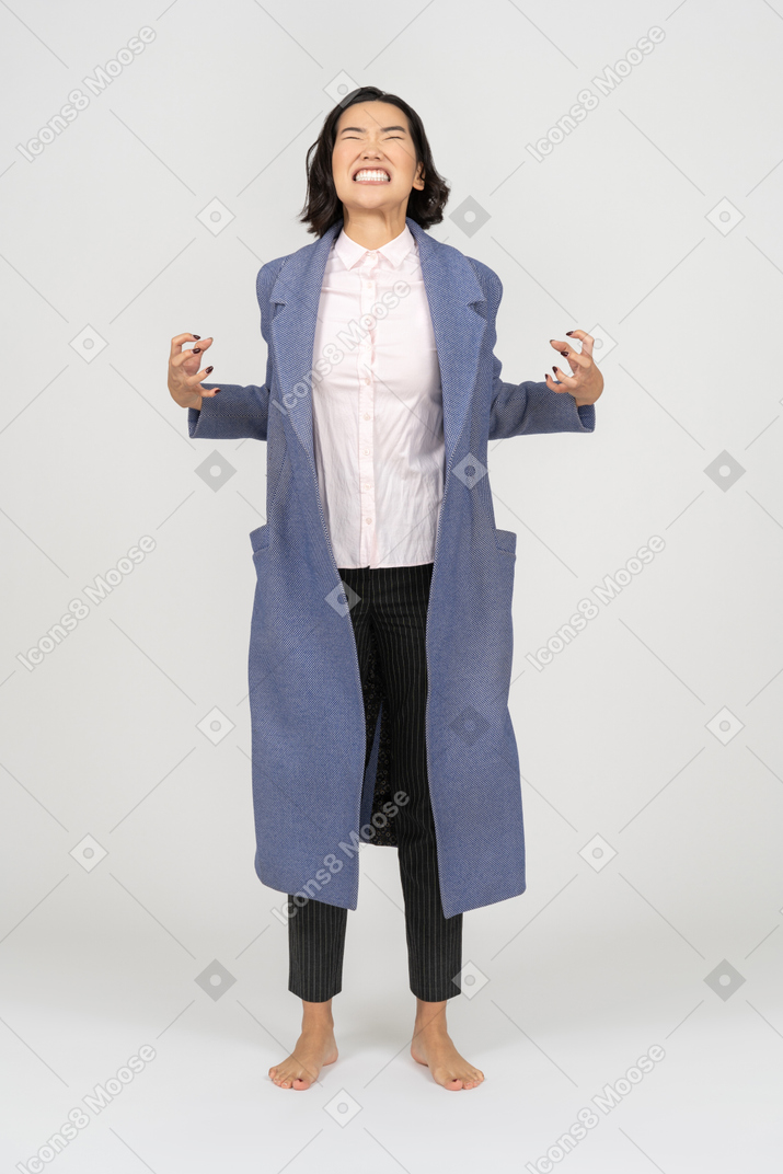 Furious woman holding coat wide open