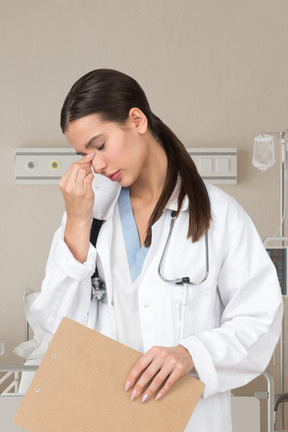 Exhausted woman doctor in the hospital