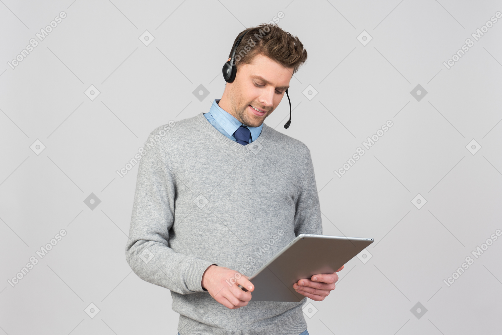 Call center agent looking on tablet
