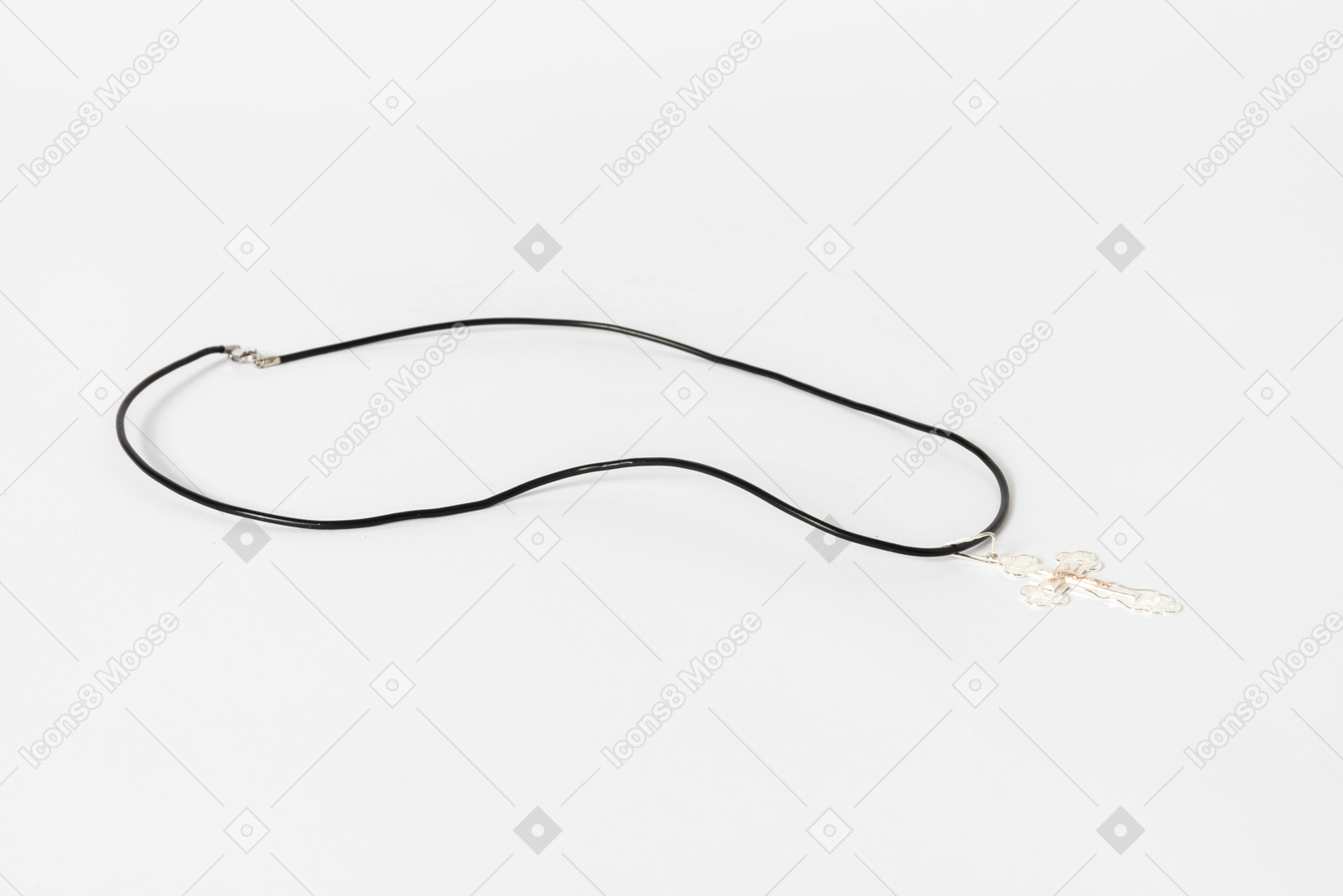 Cross necklace on white background