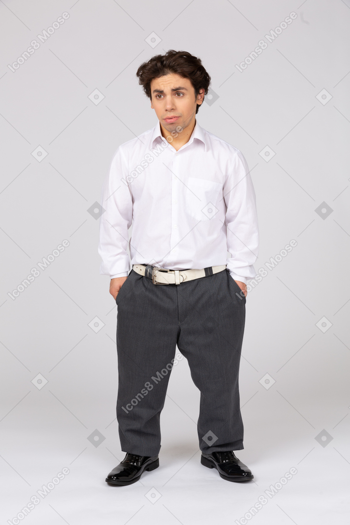Front view of an annoyed man in formal wear looking aside