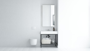 Bagno bianco con wc sospeso e lavabo