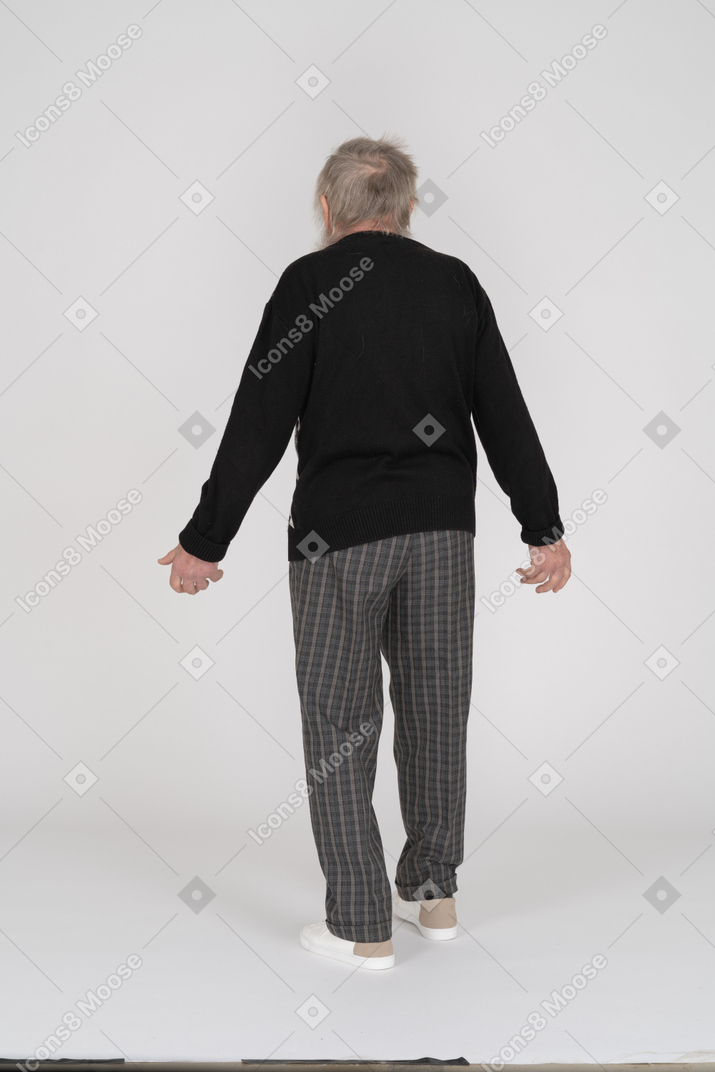Back view of old man spreading arms