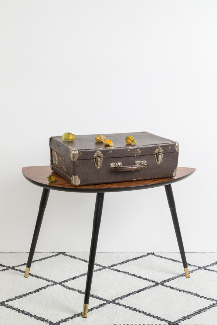 Vintage suitcase on vintage coffee table