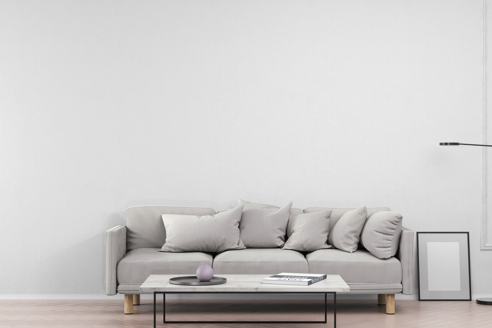 A cozy living room in grey colors, with a sofa and a coffee table in front of it