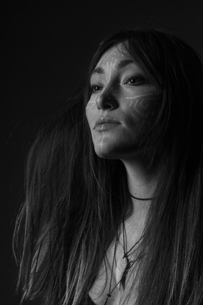 A black and white photo of a woman with long hair