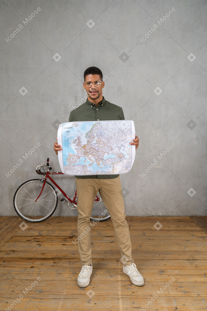 Front view of a man holding a map