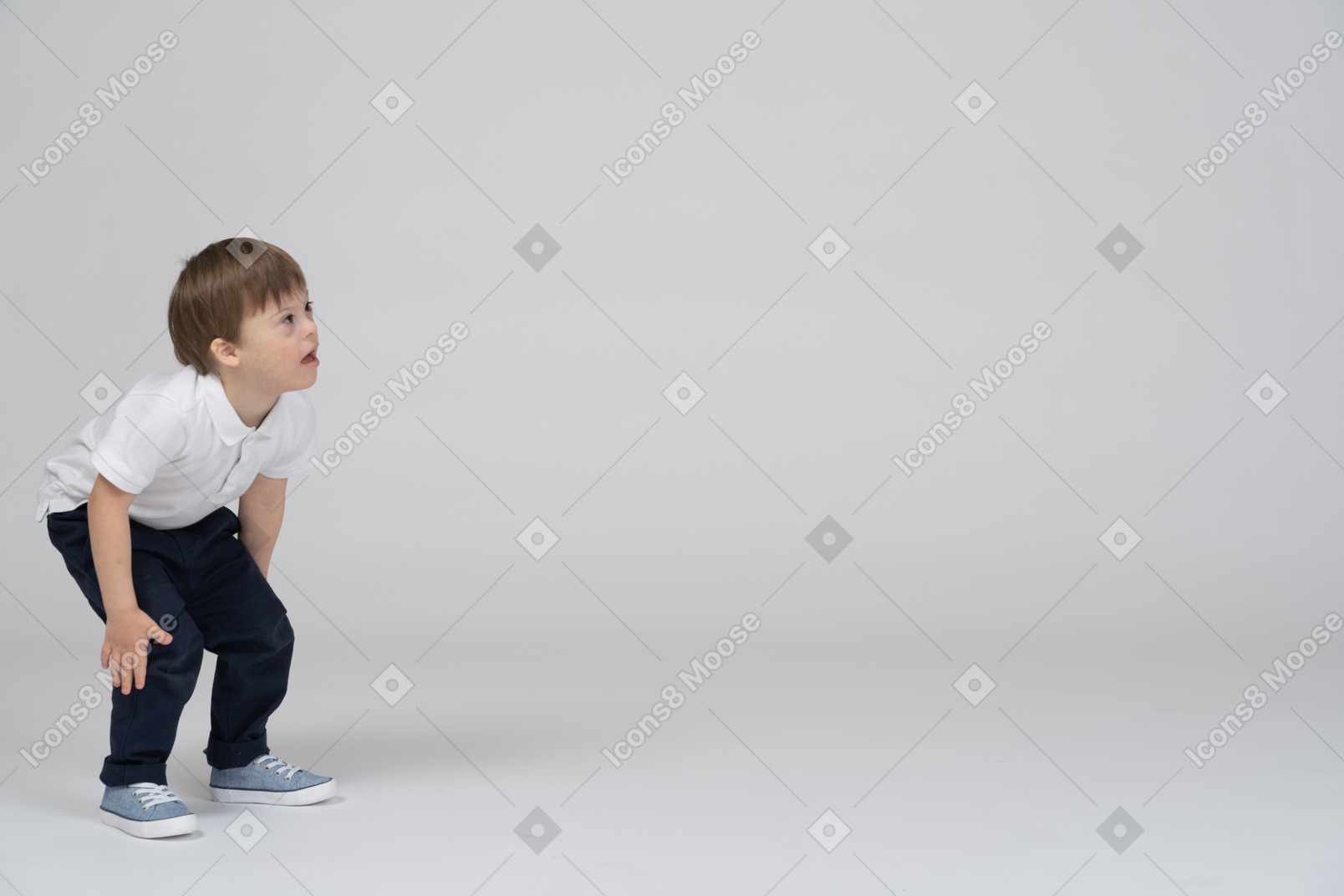 Little boy standing with bent knees