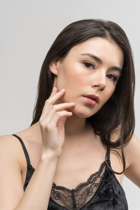 Thoughtful young woman facing the camera