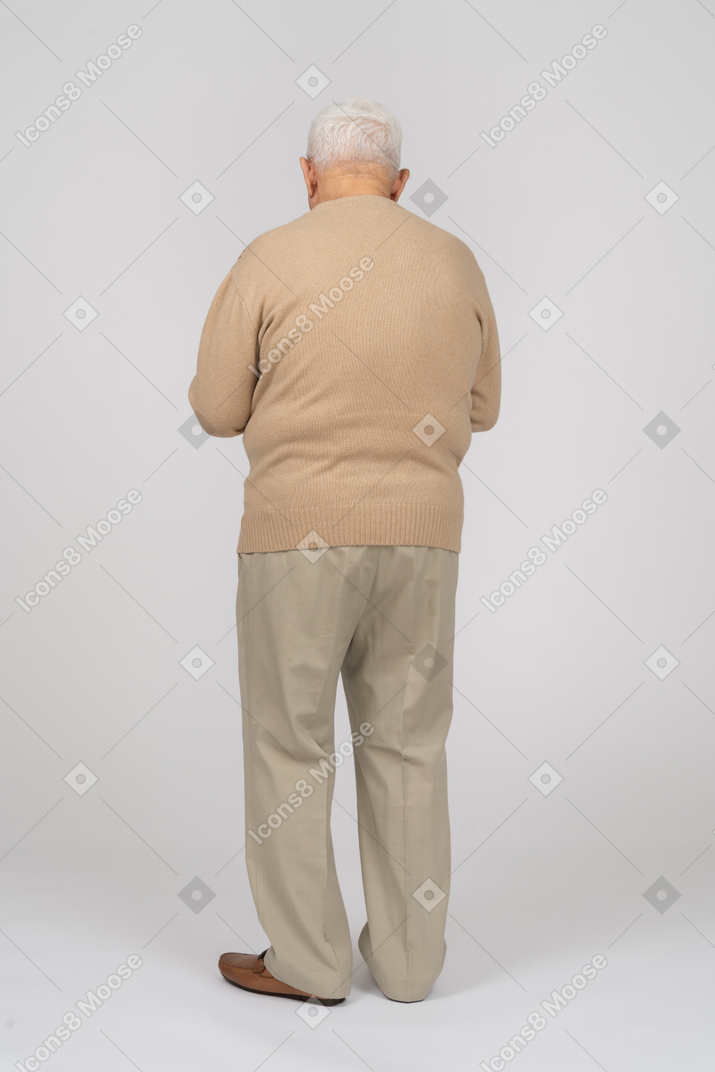 Rear view of an old man in casual clothes