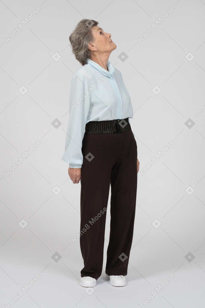 Old woman turning head and looking