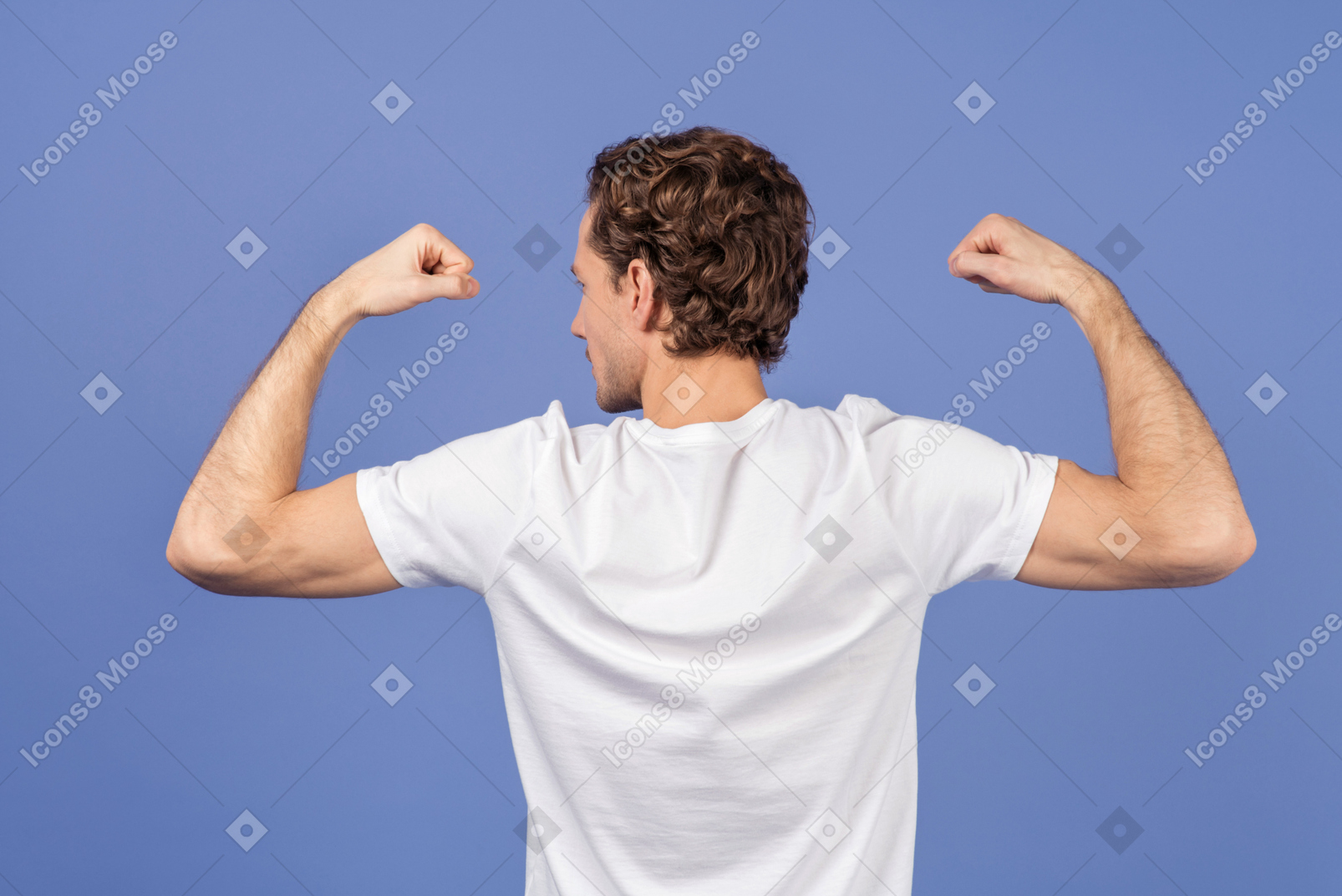 Young man showing his muscles