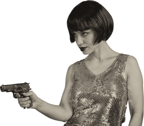 Woman with bob hairstyle aiming the gun sideways